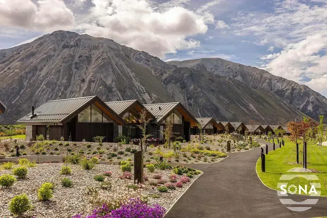 a row of cabins with gable end windows covered with apex blinds