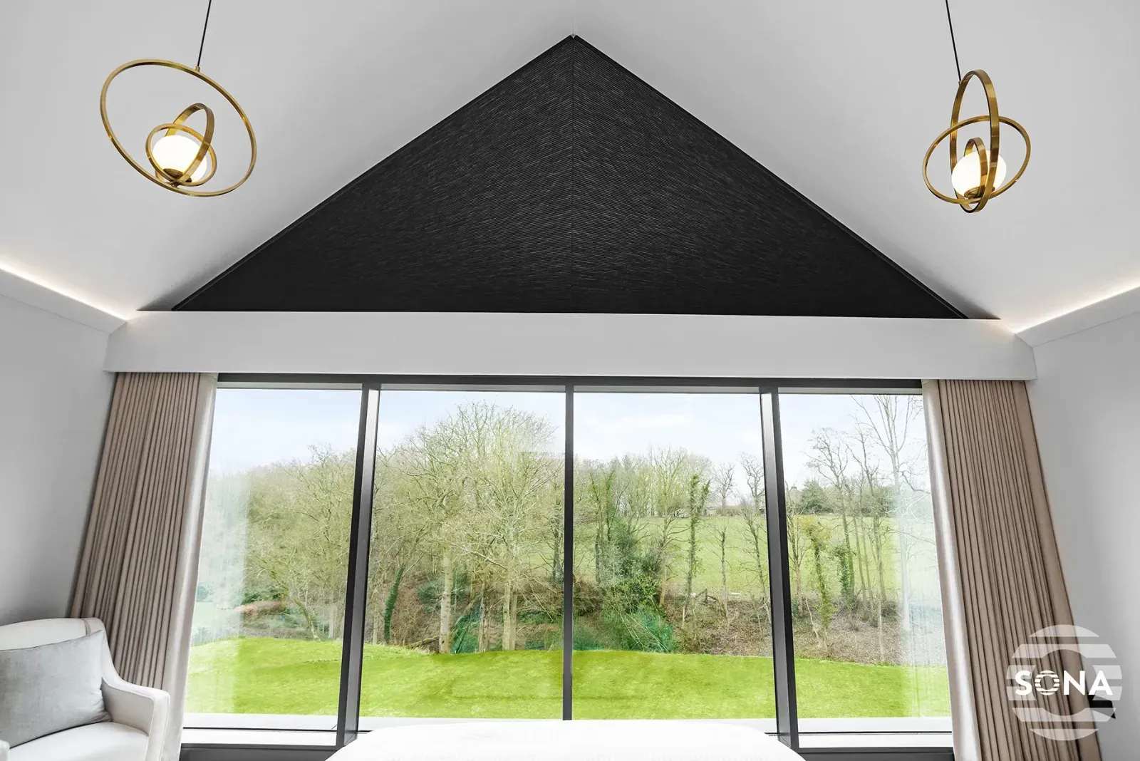 close up of a large apex window with a black apex blind covering the top part of the window