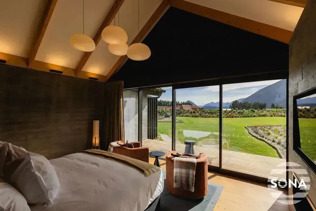 partly closed apex window blinds in a bedroom with lights hanging from the ceiling