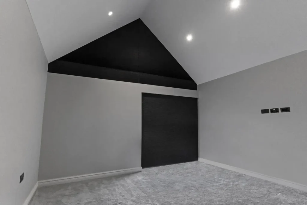 a bedroom with blackout smart blinds in a closed position