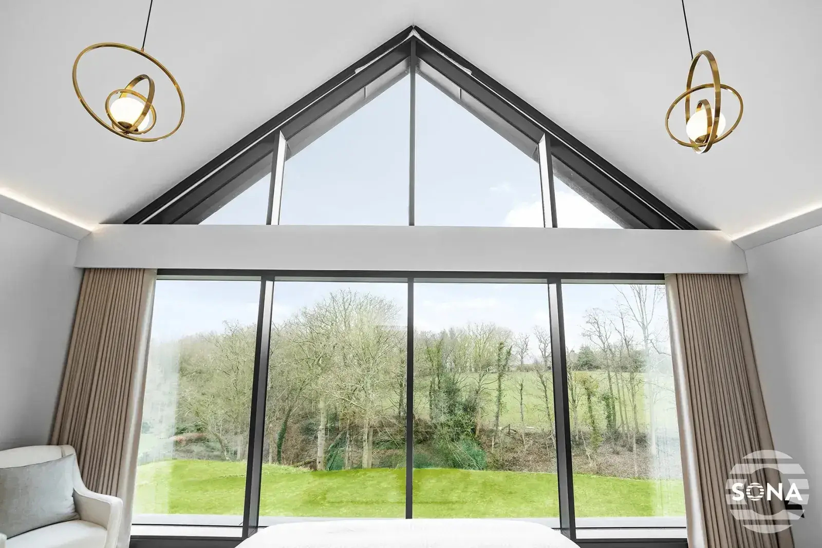 fully open large shaped window blind fitted to a large triangle shaped large window covered by a window